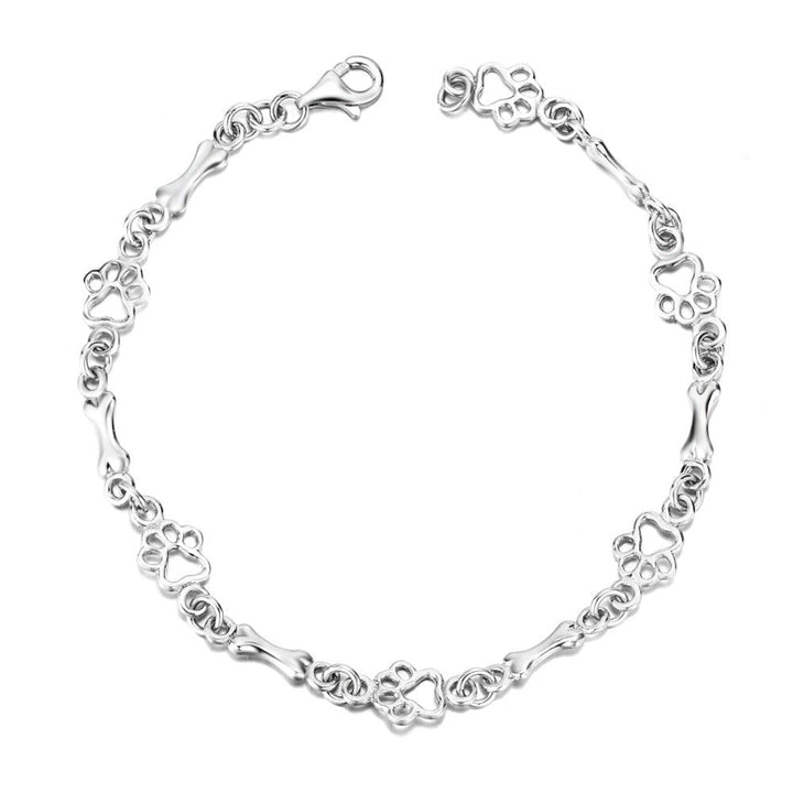 Pulseira de prata sólida com pendentes de pata e osso de cão