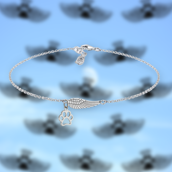 Pulseira memorial em prata com asas de anjo e pegada de animal artesanal