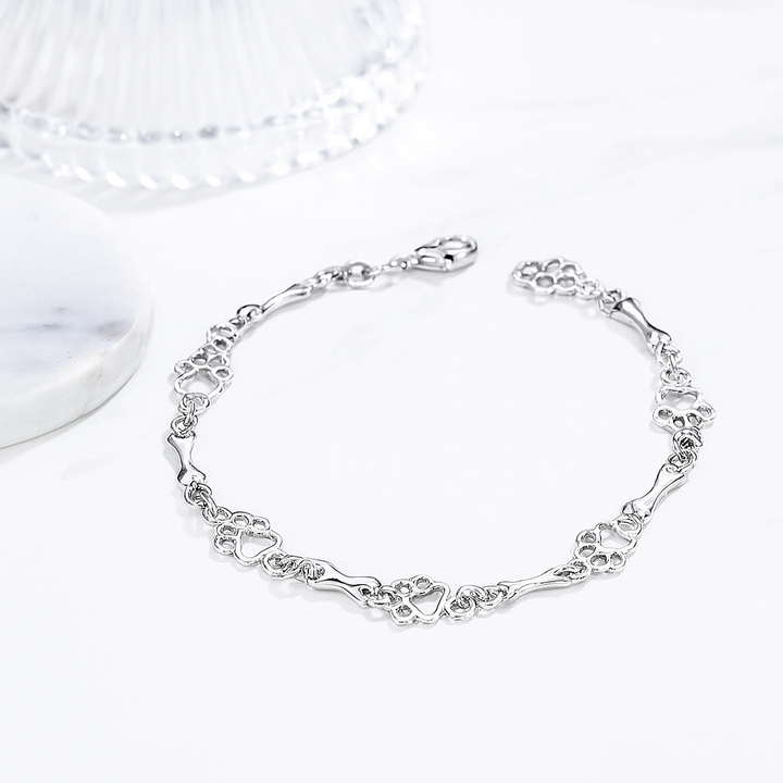 Pulseira de prata sólida com pendentes de pata e osso de cão